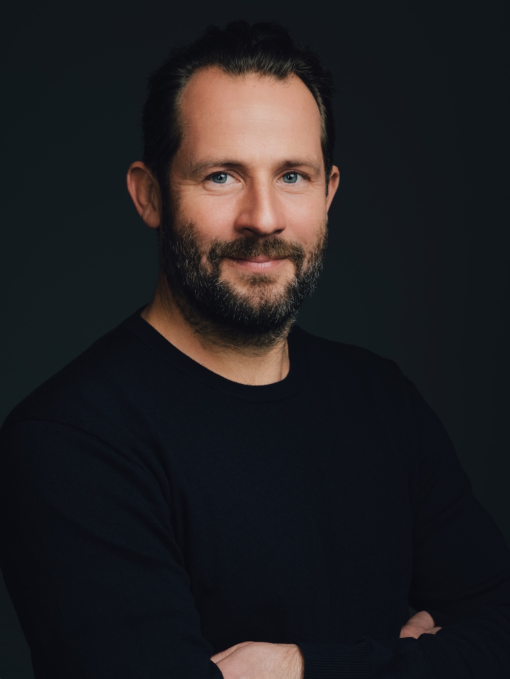 Gregor Schmalix looks into the camera with his arms crossed.